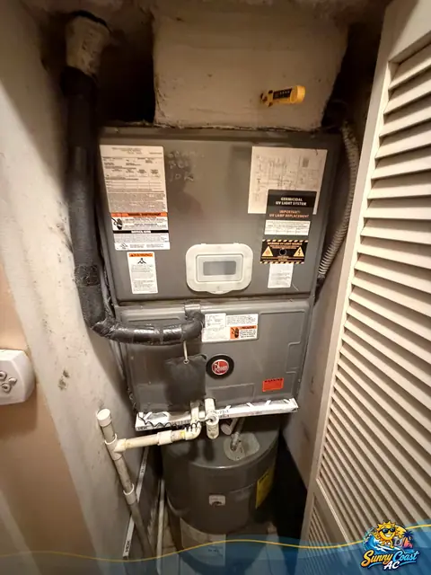 Air handler repair in a tight closet by Sunny Coast AC in South Florida
