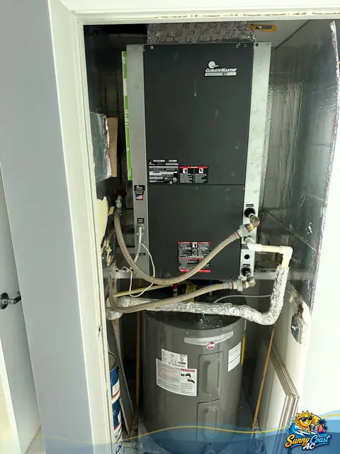 Air handler service above a water heater by Sunny Coast AC in South Florida